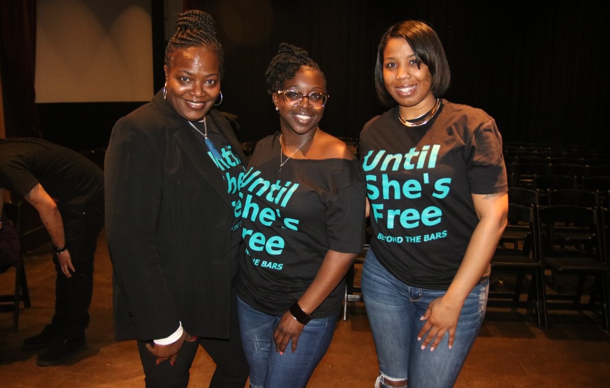 Beyond the Bars organizers posing in their "Until She's Free" shirts