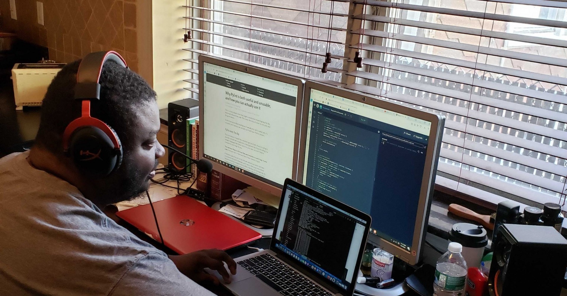 Justice Through Code students sitting at a computer while coding.