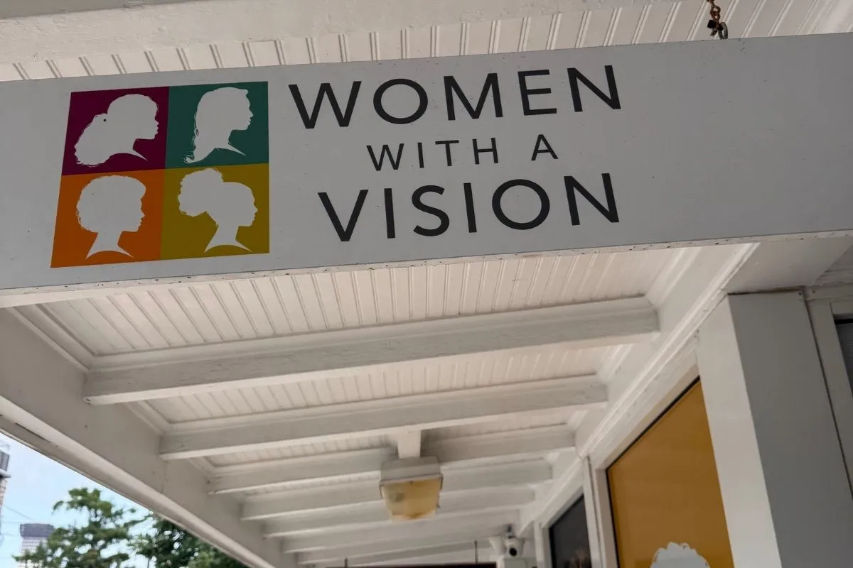 Sign that says Women With A Vision