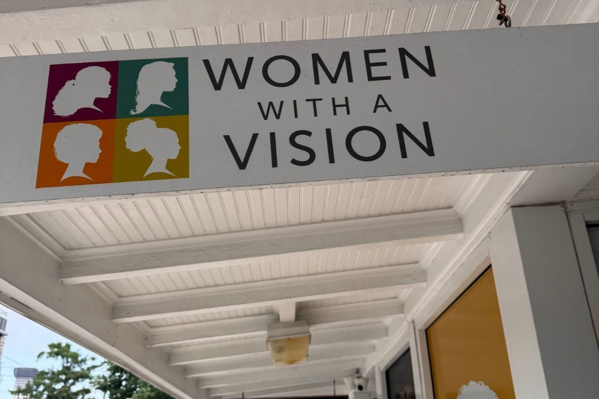 Sign that says Women With A Vision