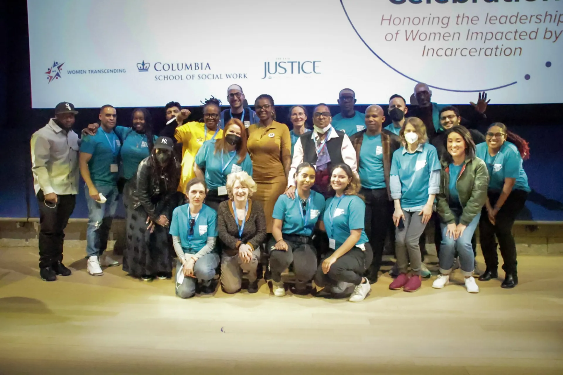 Center for Justice staff group picture in their Beyond the Bars blue shirts