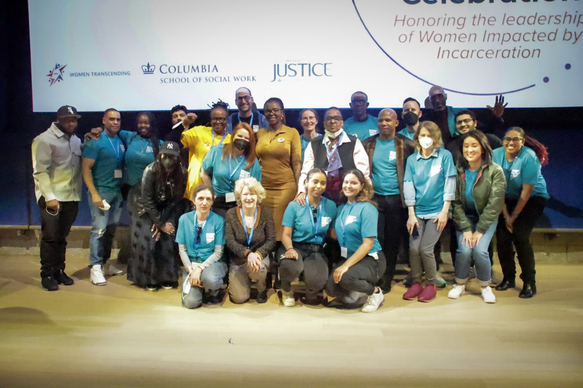 Center for Justice staff group picture in their Beyond the Bars blue shirts
