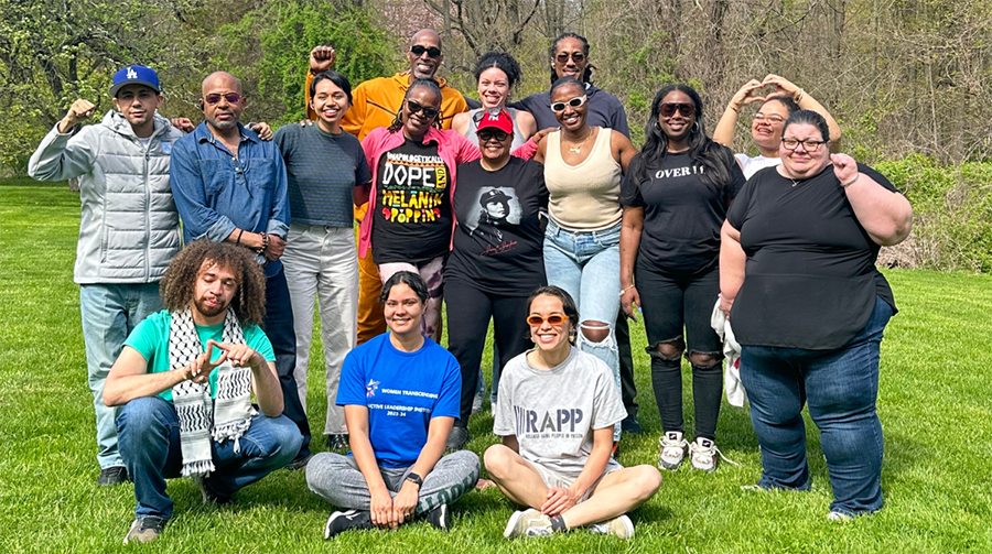 Group photo of the Beyond the Bars Fellows outside near some trees
