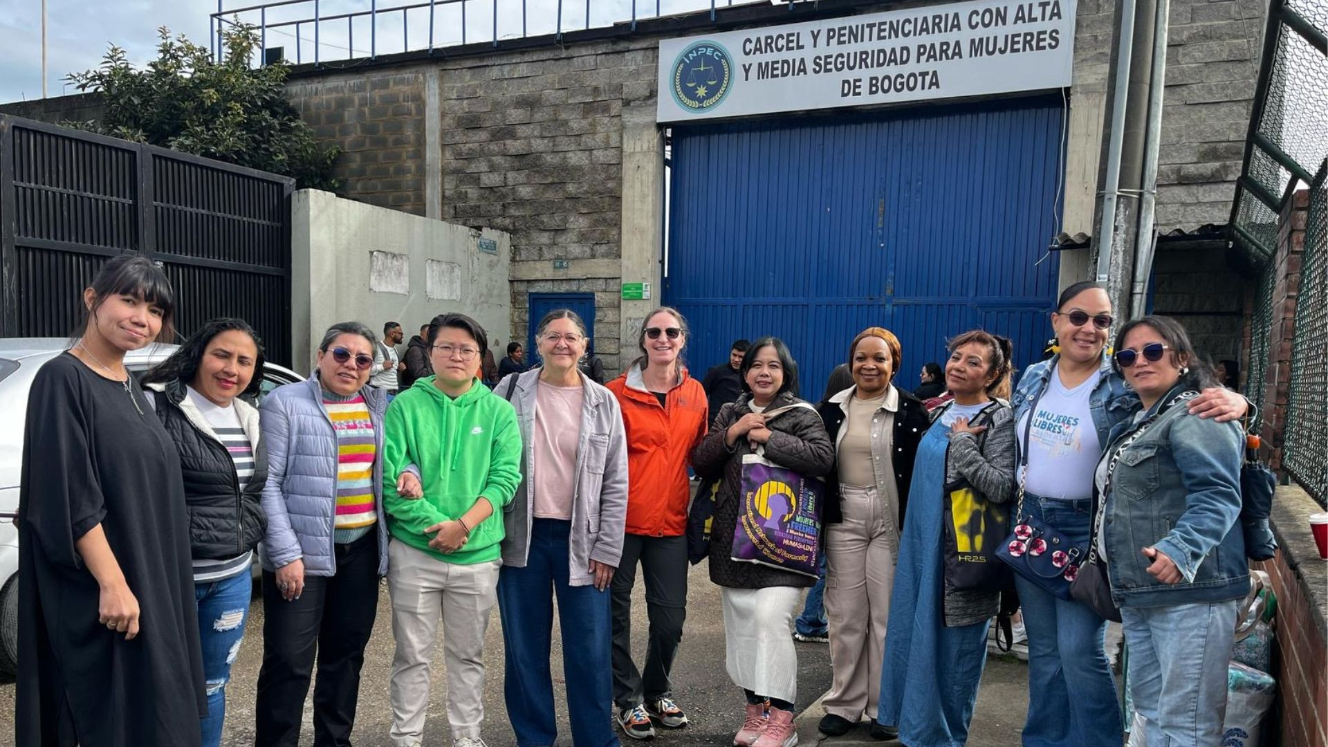 A group of women standing outside a women's prison in Bogotá, Colombia. 