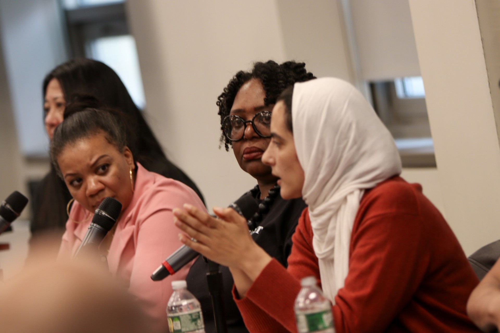 Side shot of panelists intently listening to each other