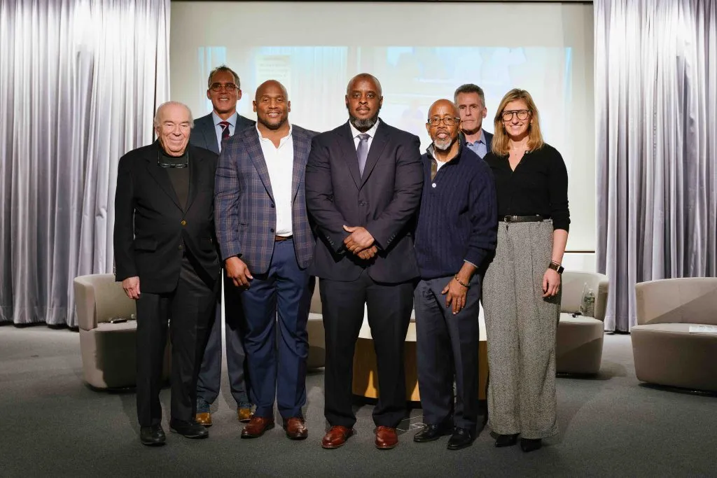 A group of panelists standing together for a picture 