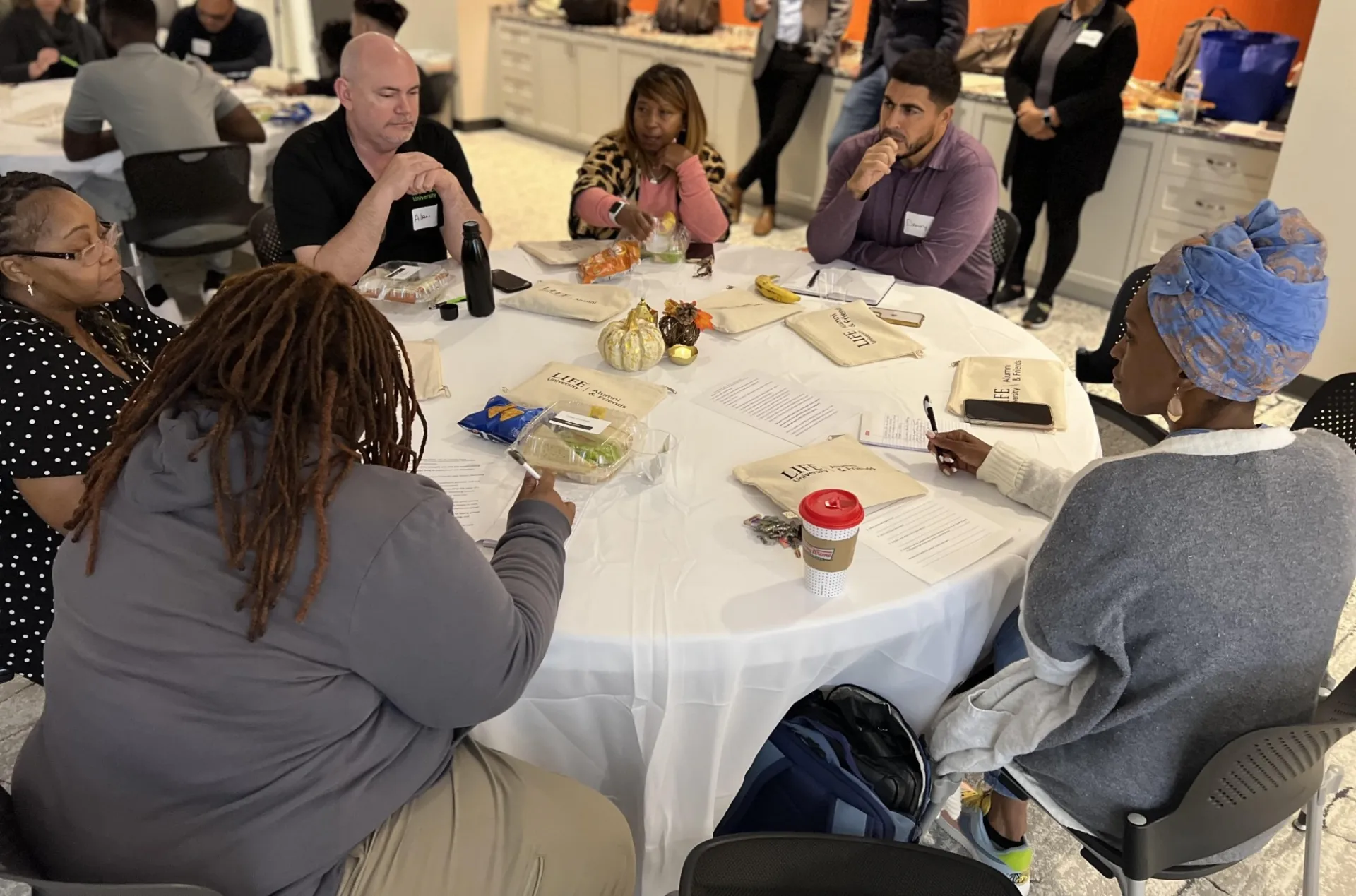 a group of people sitting around a table