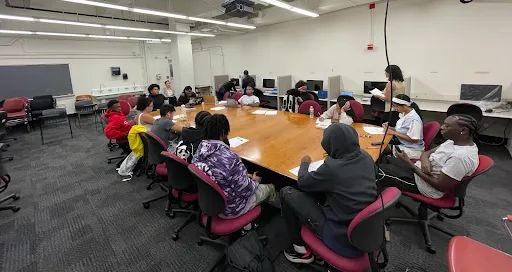 A group of youth at a conference table