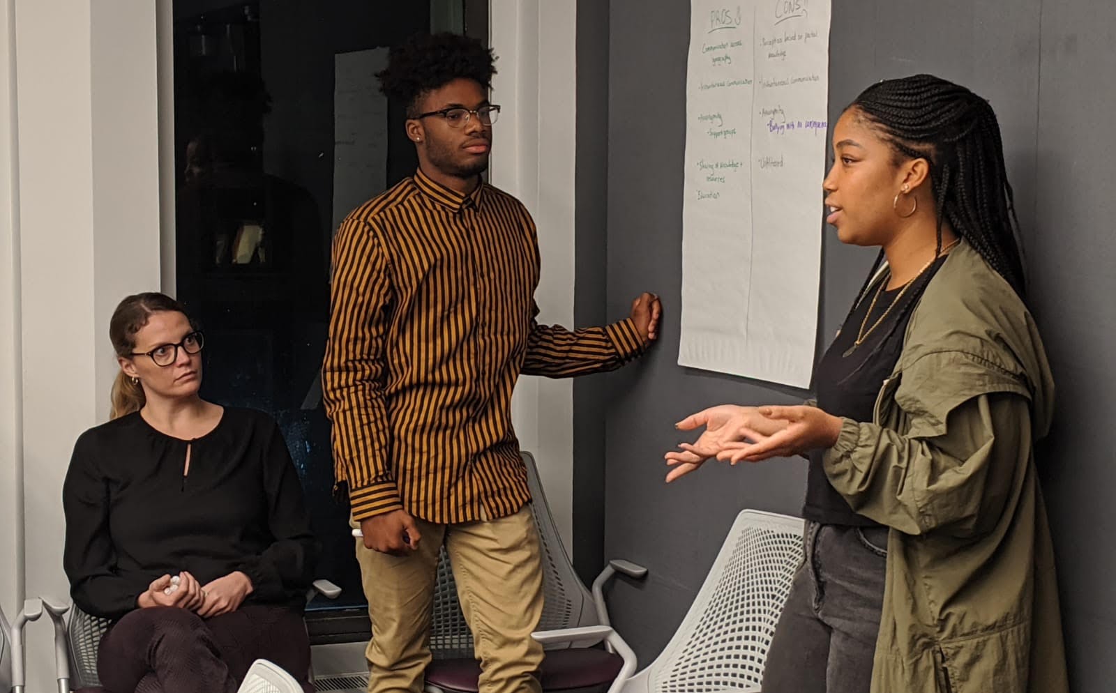 JAYC youth present at a meeting