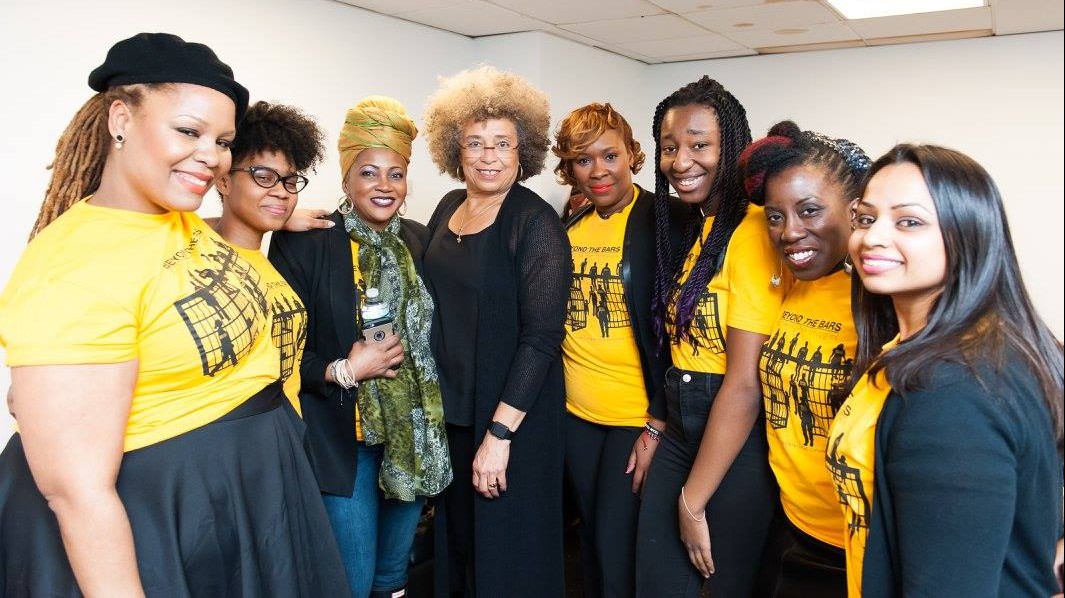 Beyond the Bars fellows pose with Angela Davis