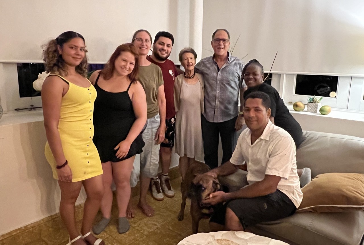 Cfj staff posing with Juan Segarra and his son